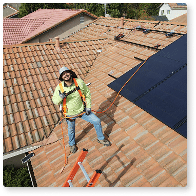 man installing solar panels