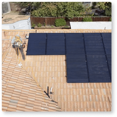 man installing solar panels