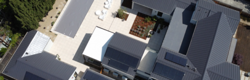 Aerial view of a modern California home with solar panels