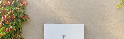 Tesla Powerwall with text on image reading "Can I Add a Battery to My Existing Solar System?"