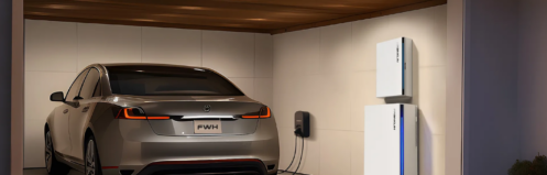 Electric vehicle plugged into an EV charger in a garage