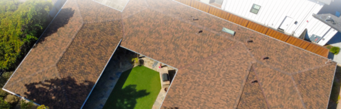 Aerial view of a home's roof with text reading "How to Choose the Right Roofing System for Your Bay Area Home"