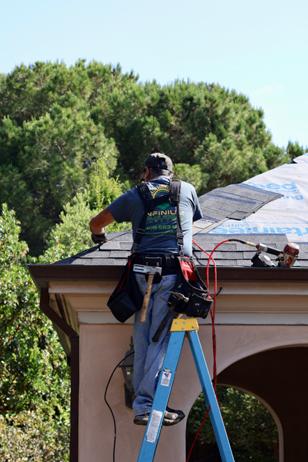 Infinium roofer working on a roof replacement
