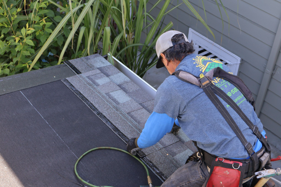 Infinium roofing professional working on a roof