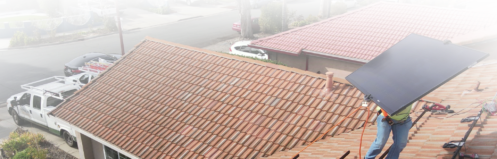 Solar panels being removed from a roof. Text on the image reads "How Much Does Solar Removal and Reinstallation Cost in the Bay Area?"